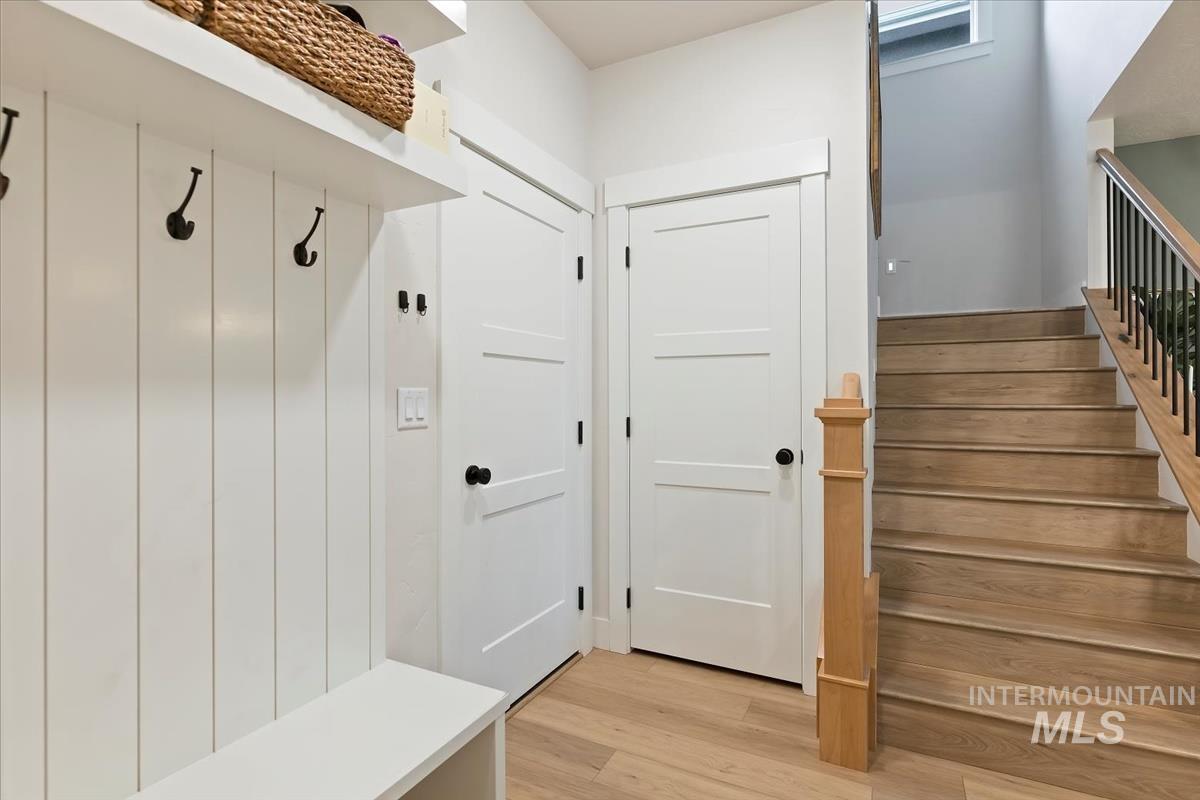 Mudroom featuring light wood-type flooring