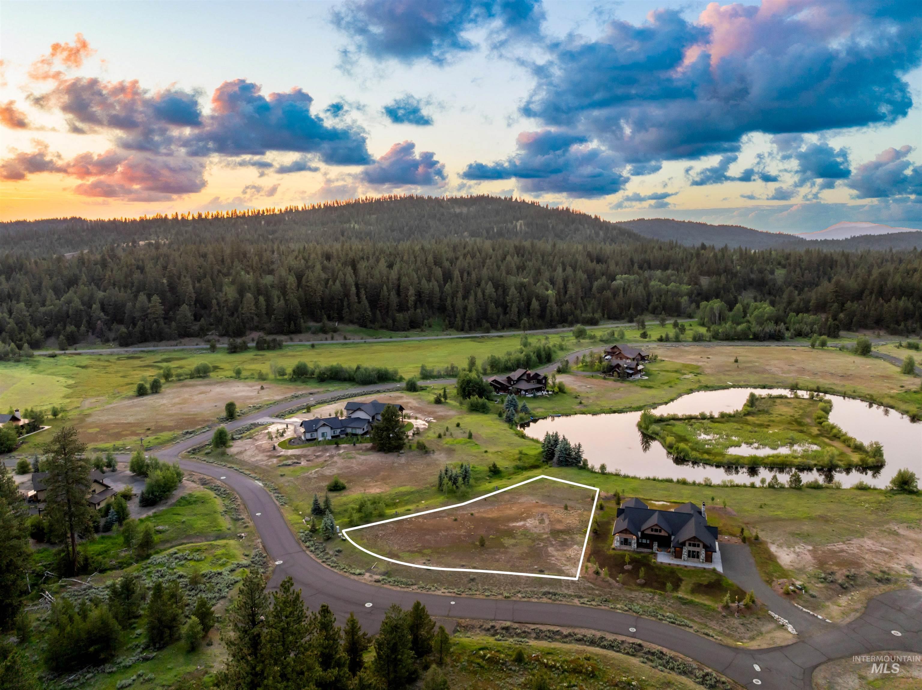 Aerial overview of property's location featuring a water and mountain view and property parcel outlined