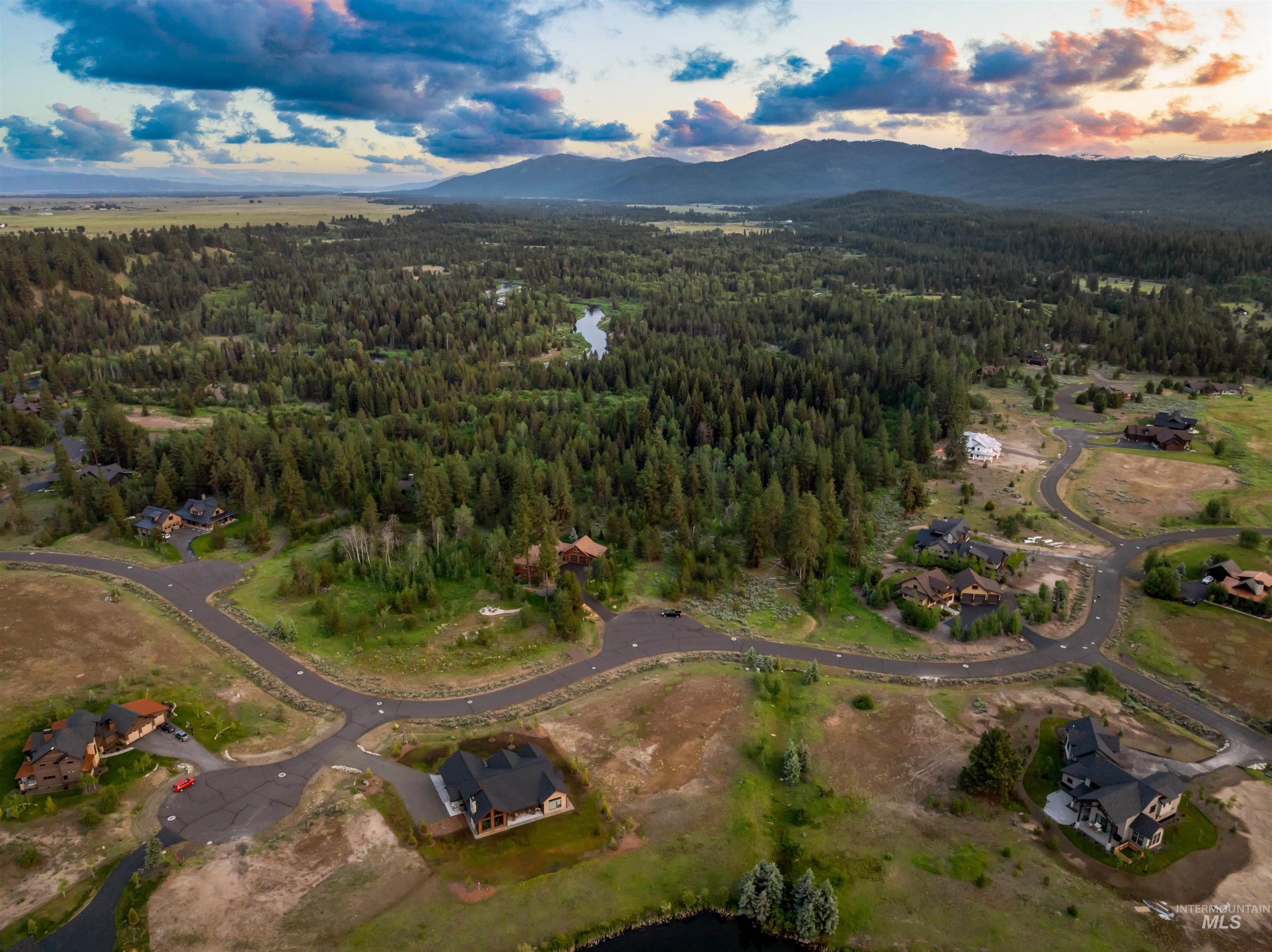 View of property location with a forest and a mountain backdrop
