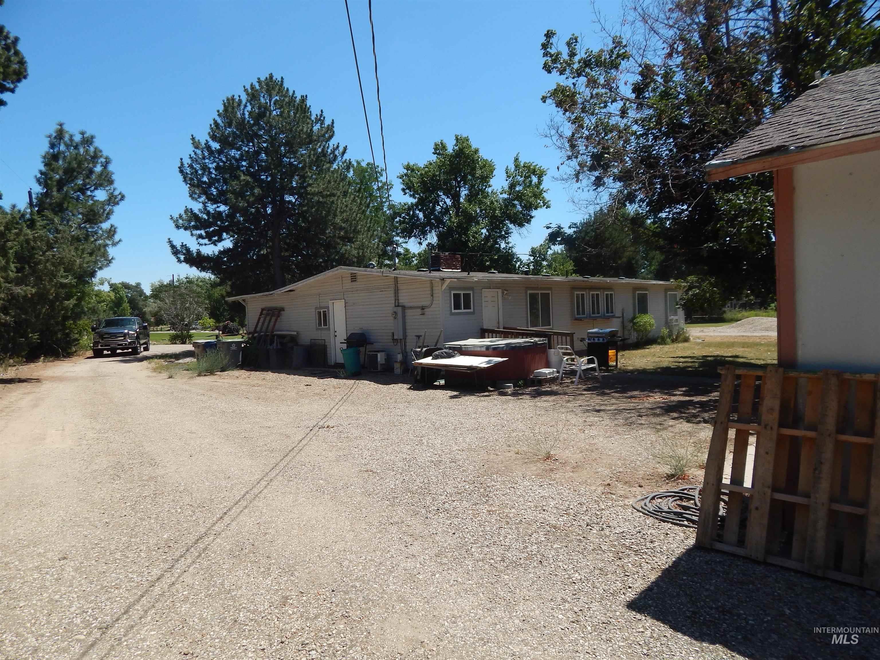 View of front facade with dirt driveway