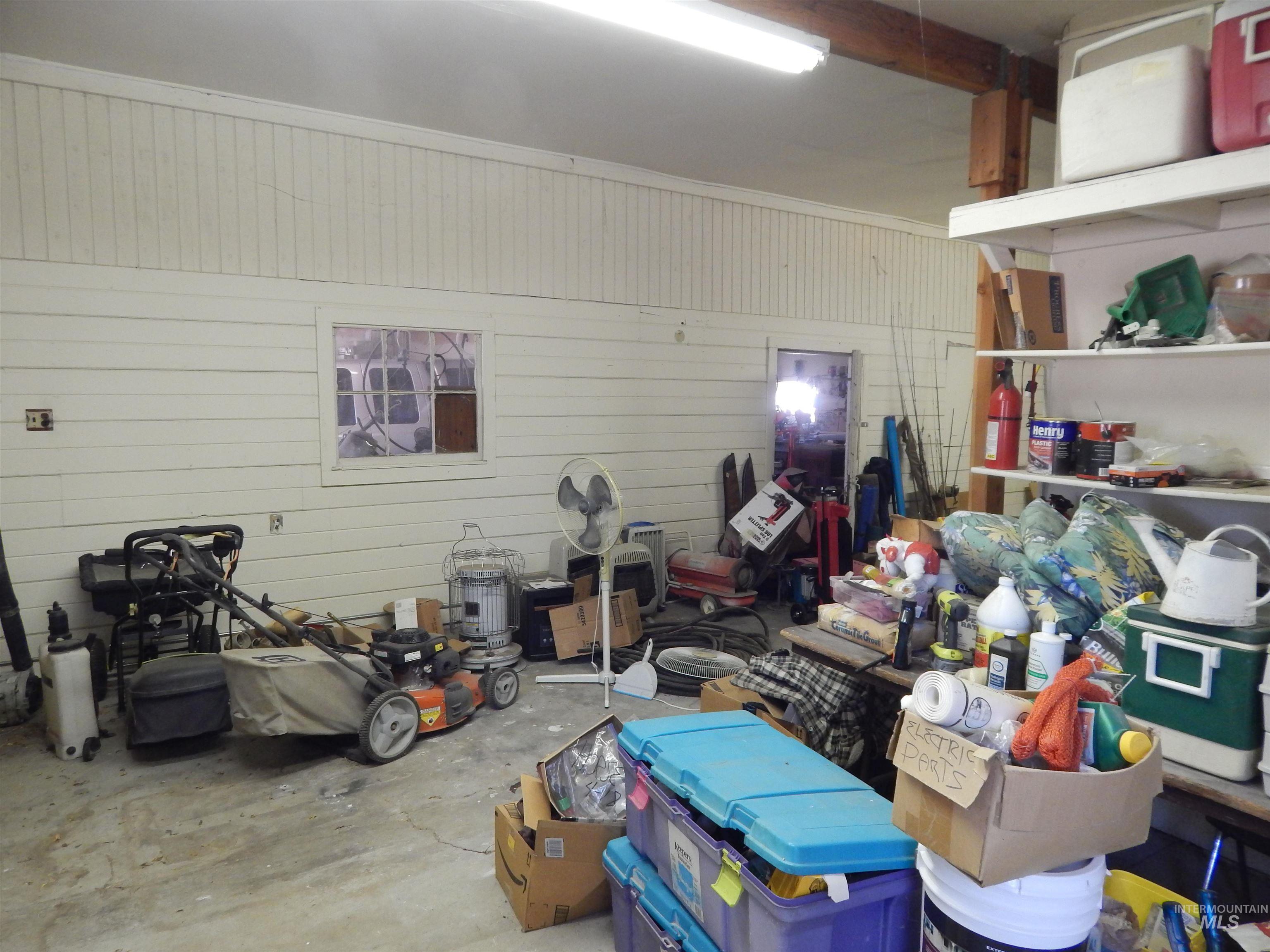 Garage featuring wood walls