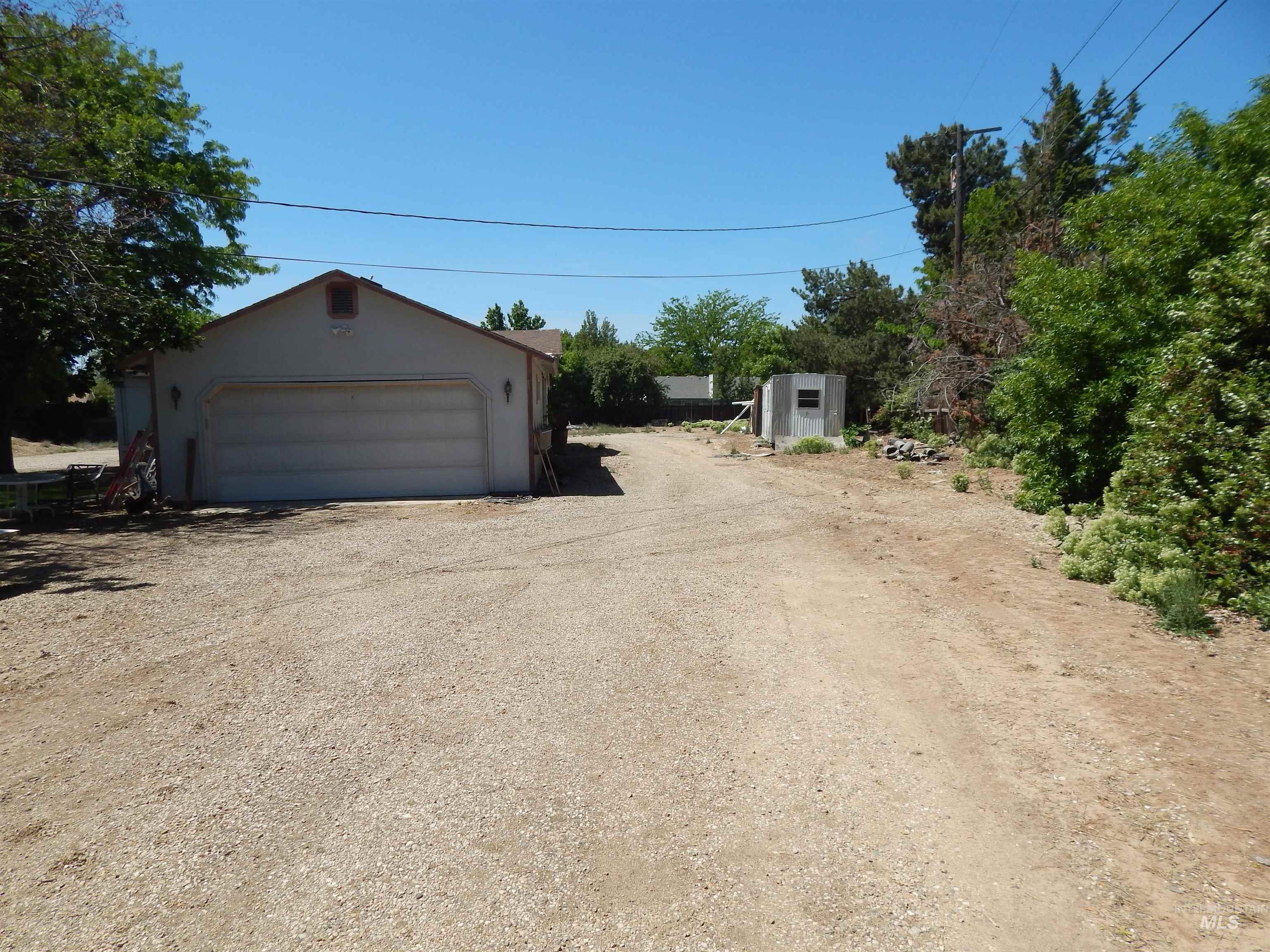 Detached garage with a storage shed
