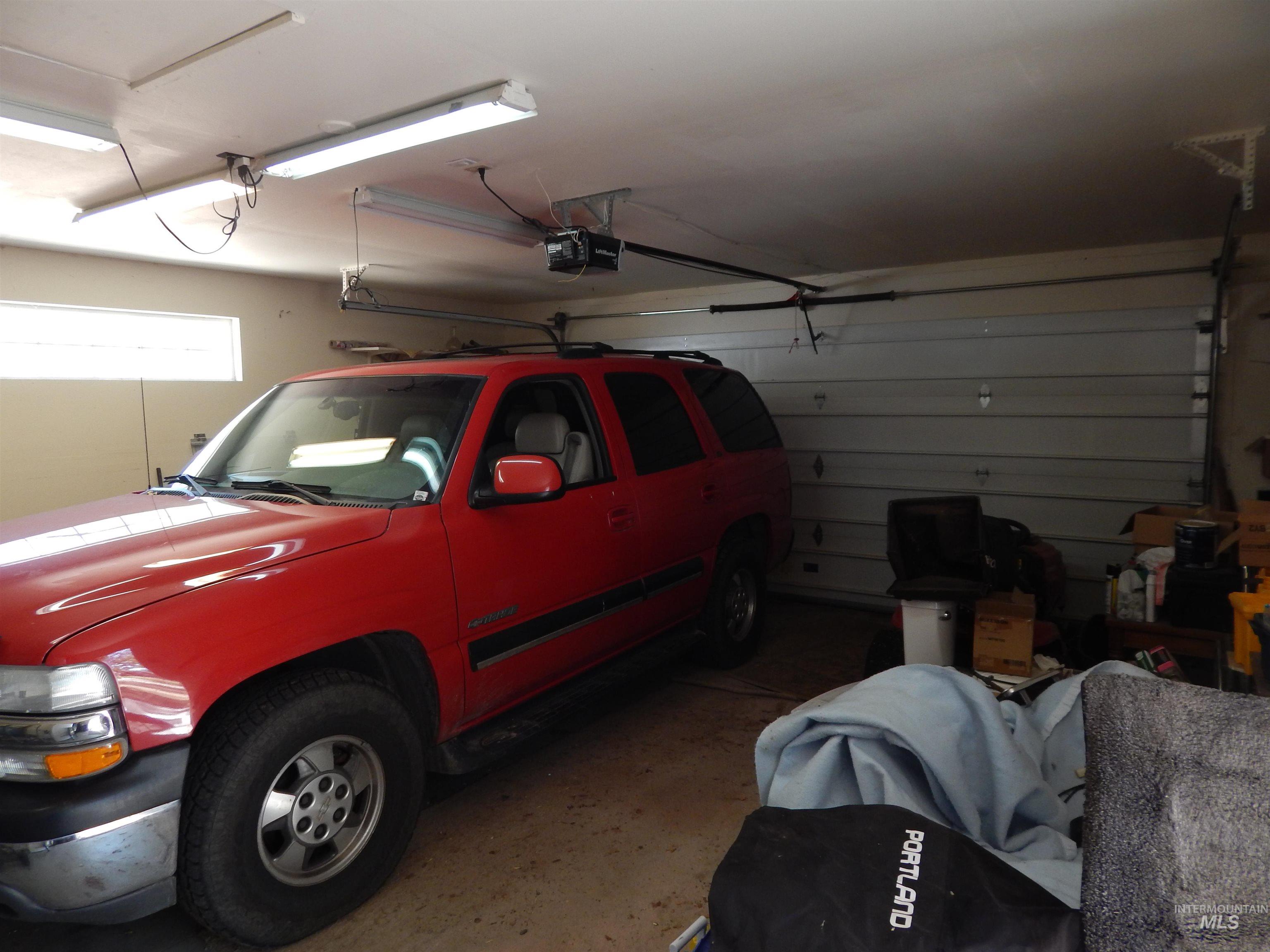 Garage featuring a garage door opener
