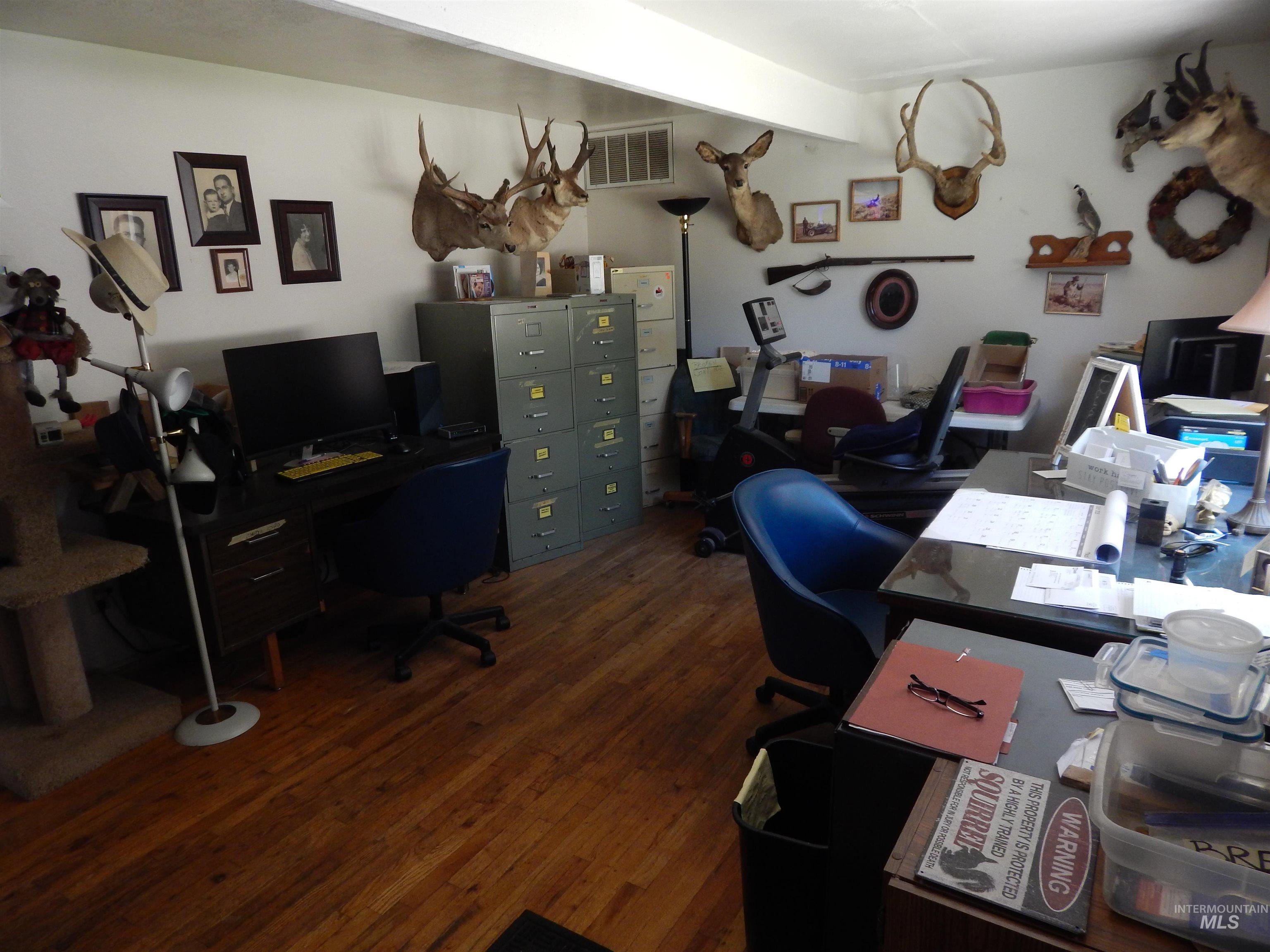 Office area with dark wood finished floors