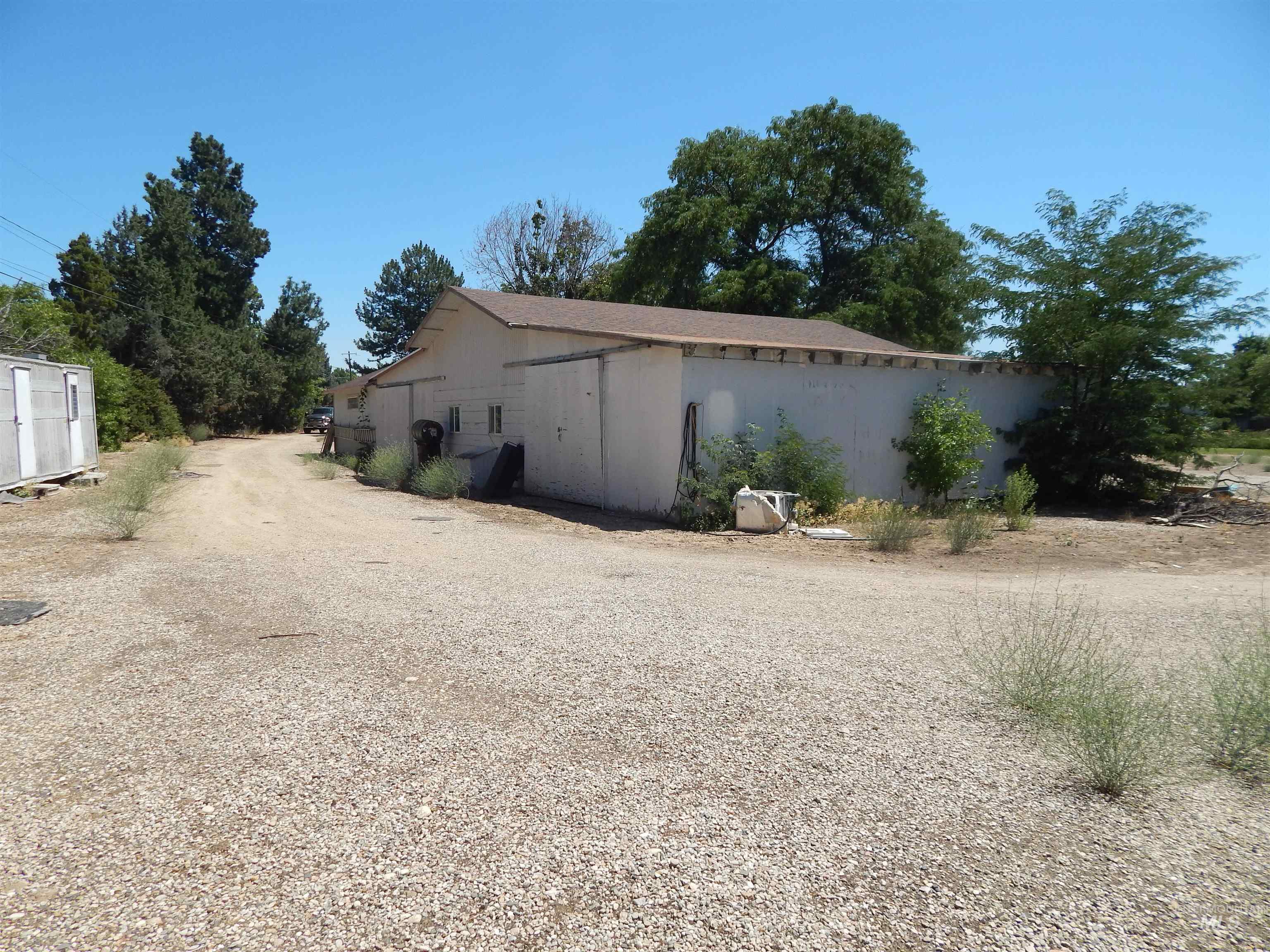 View of property exterior with an outdoor structure