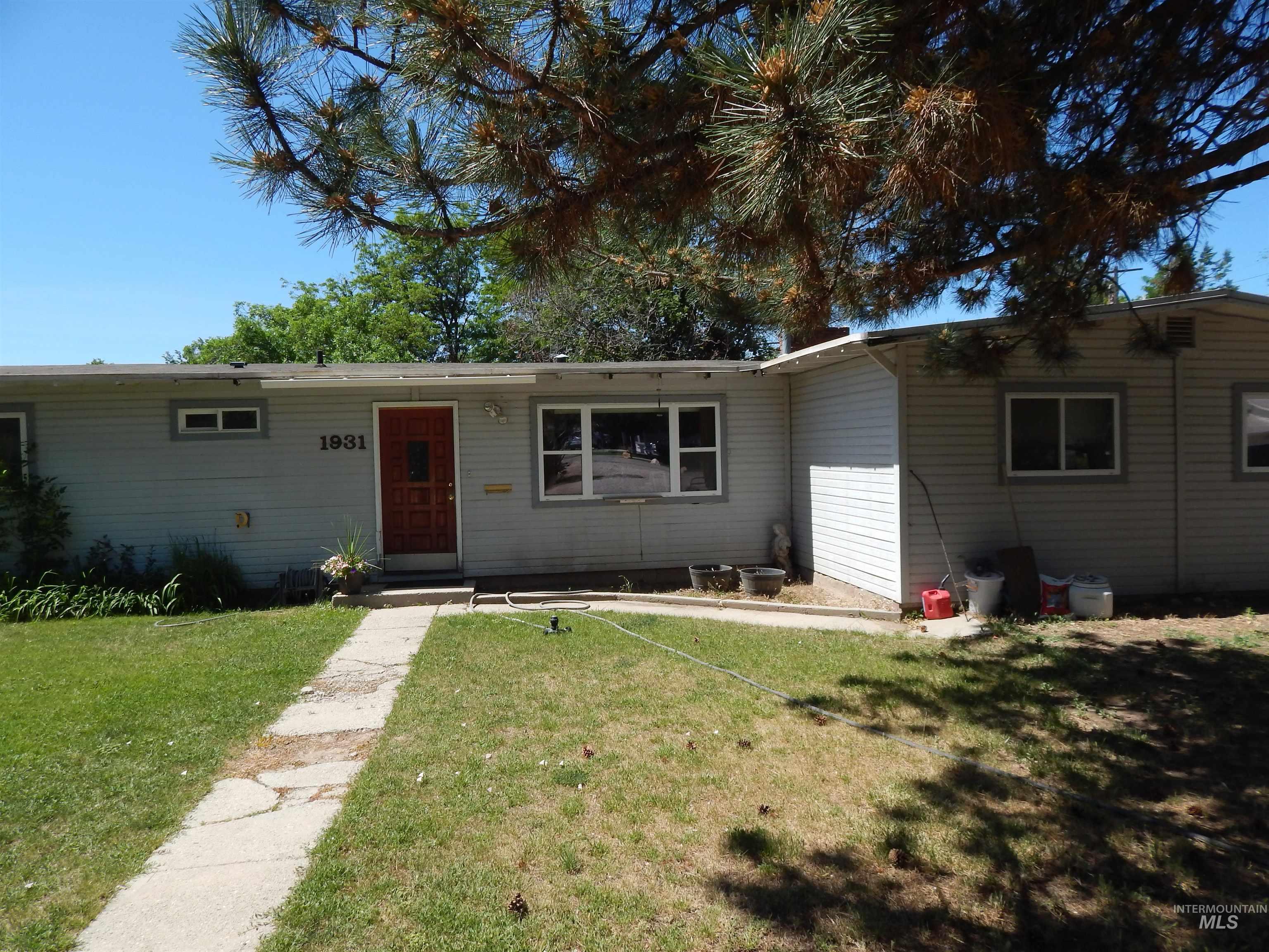 Single story home featuring a front yard