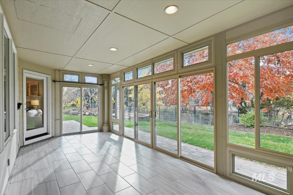 Unfurnished sunroom featuring recessed lighting
