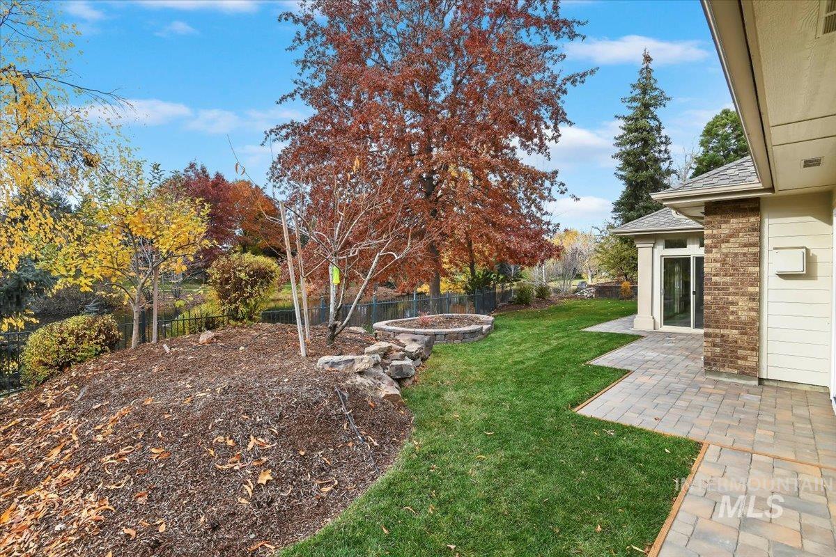 Fenced backyard with a patio