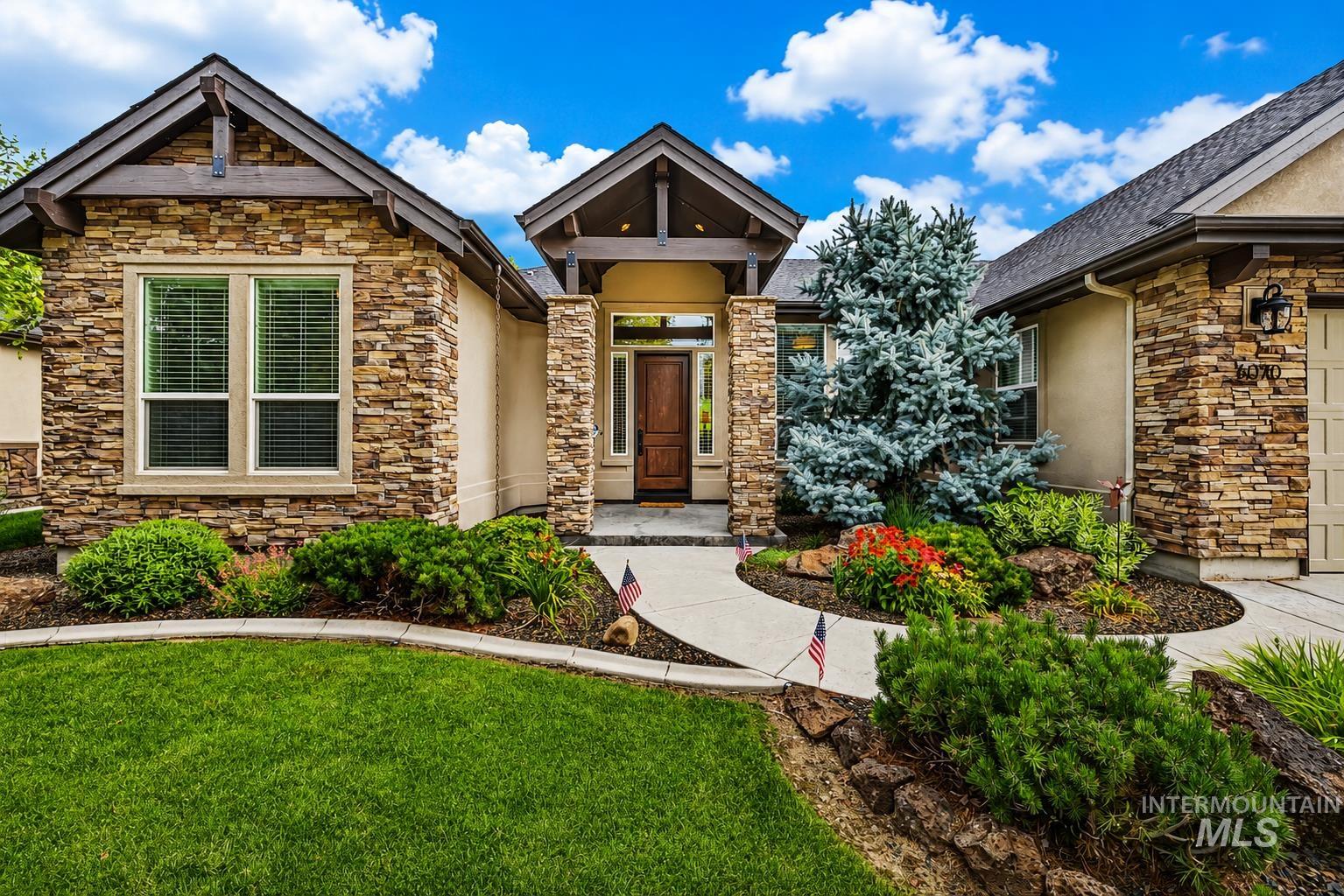 Stone veneer exterior with stucco accents