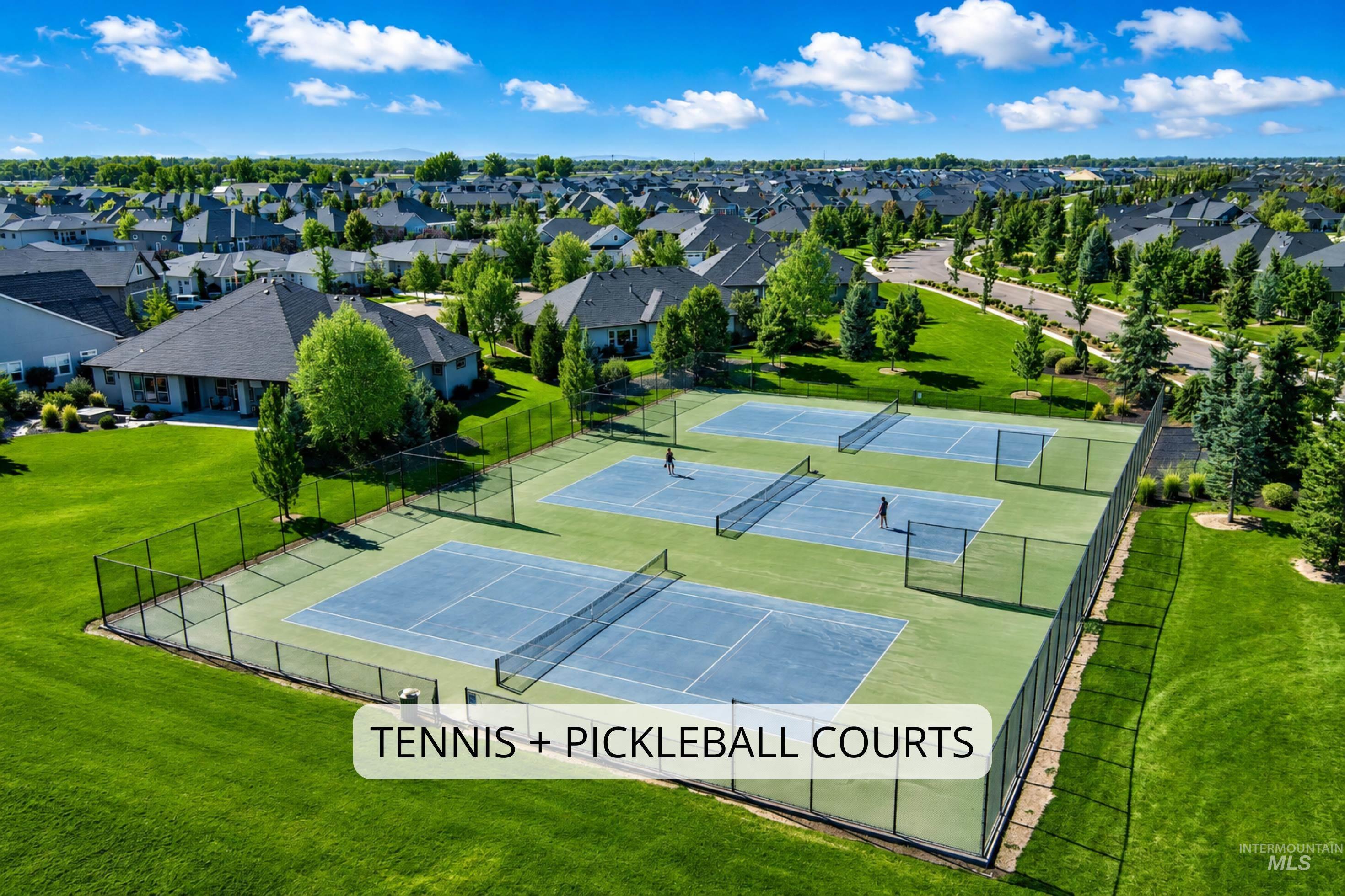 Fenced tennis and pickleball courts with blue and green surfacing