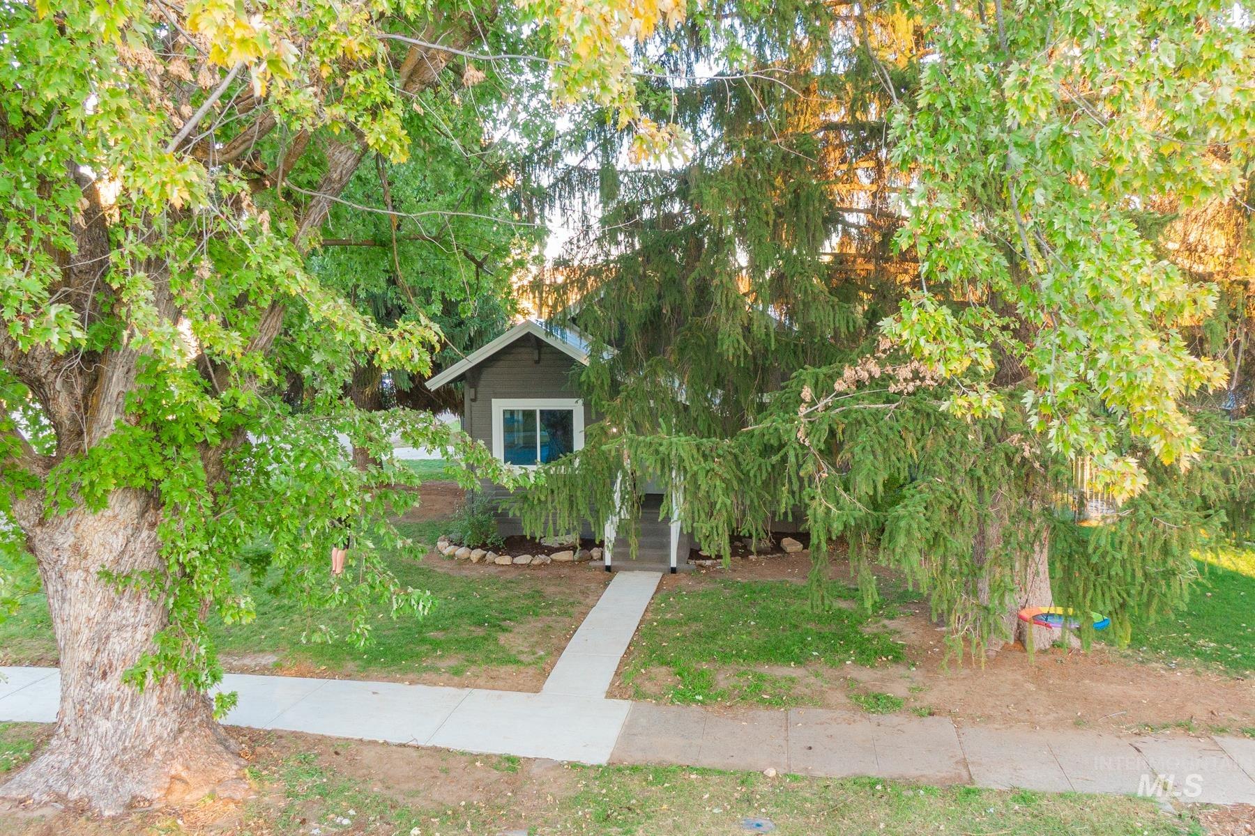 View of property hidden behind natural elements