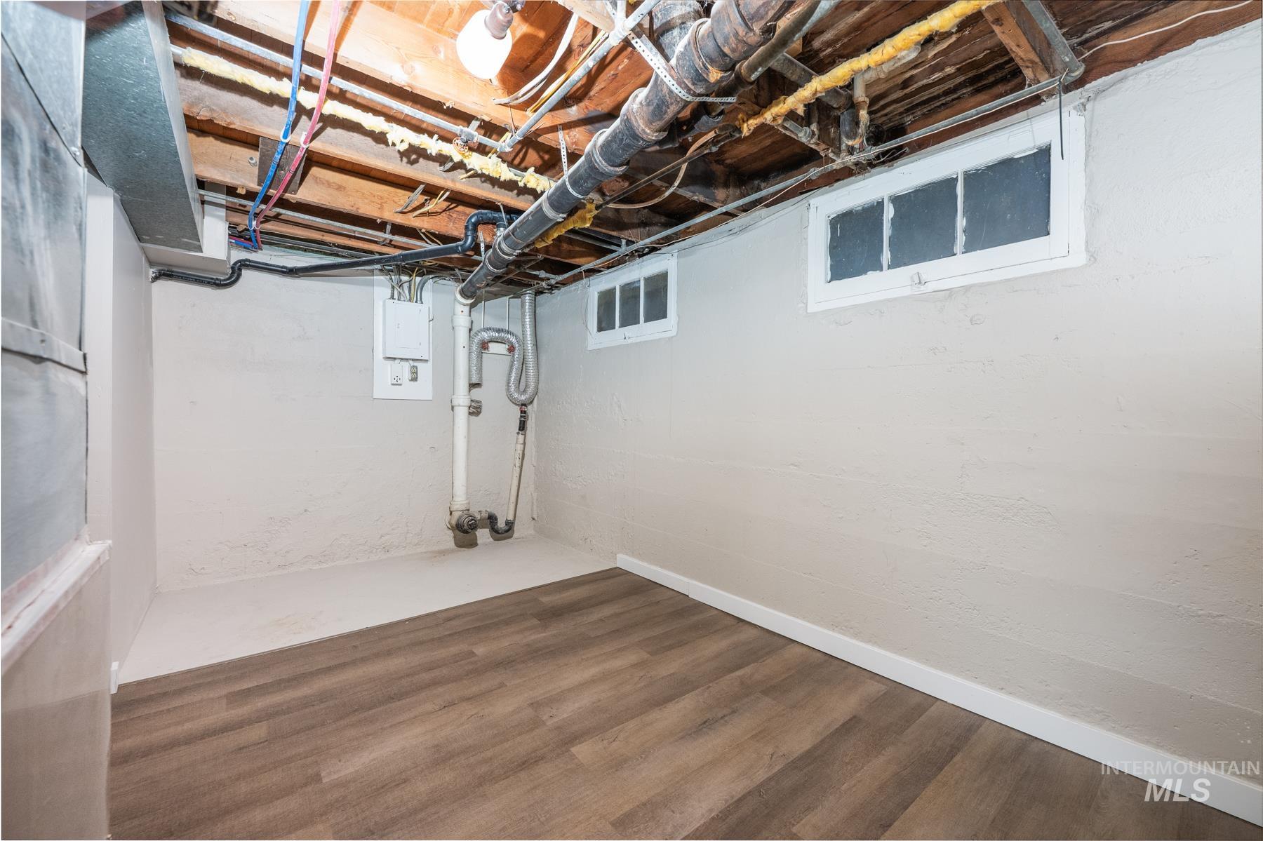 Unfinished below grade area with wood finished floors