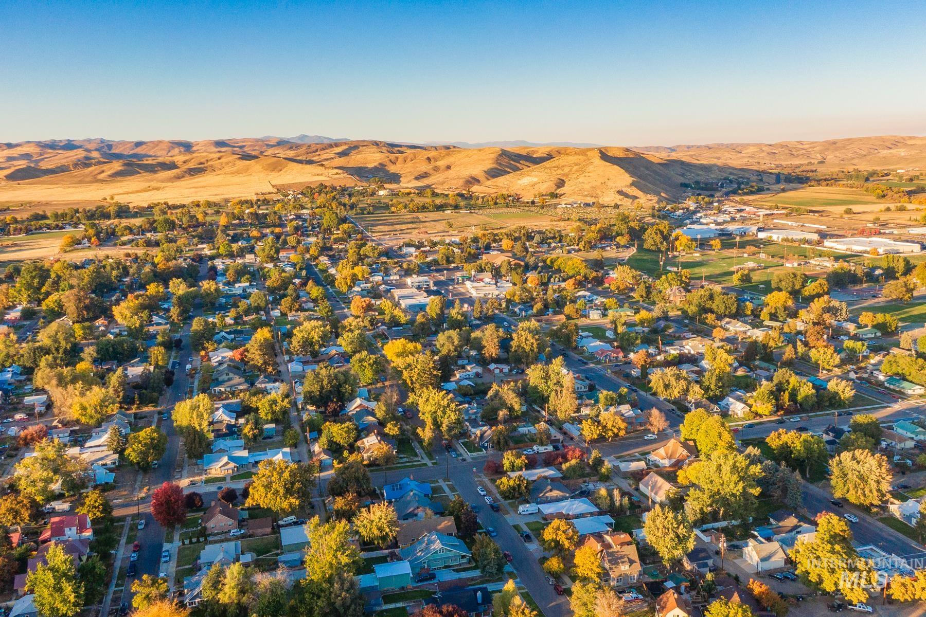 Aerial perspective of suburban area with a mountainous background