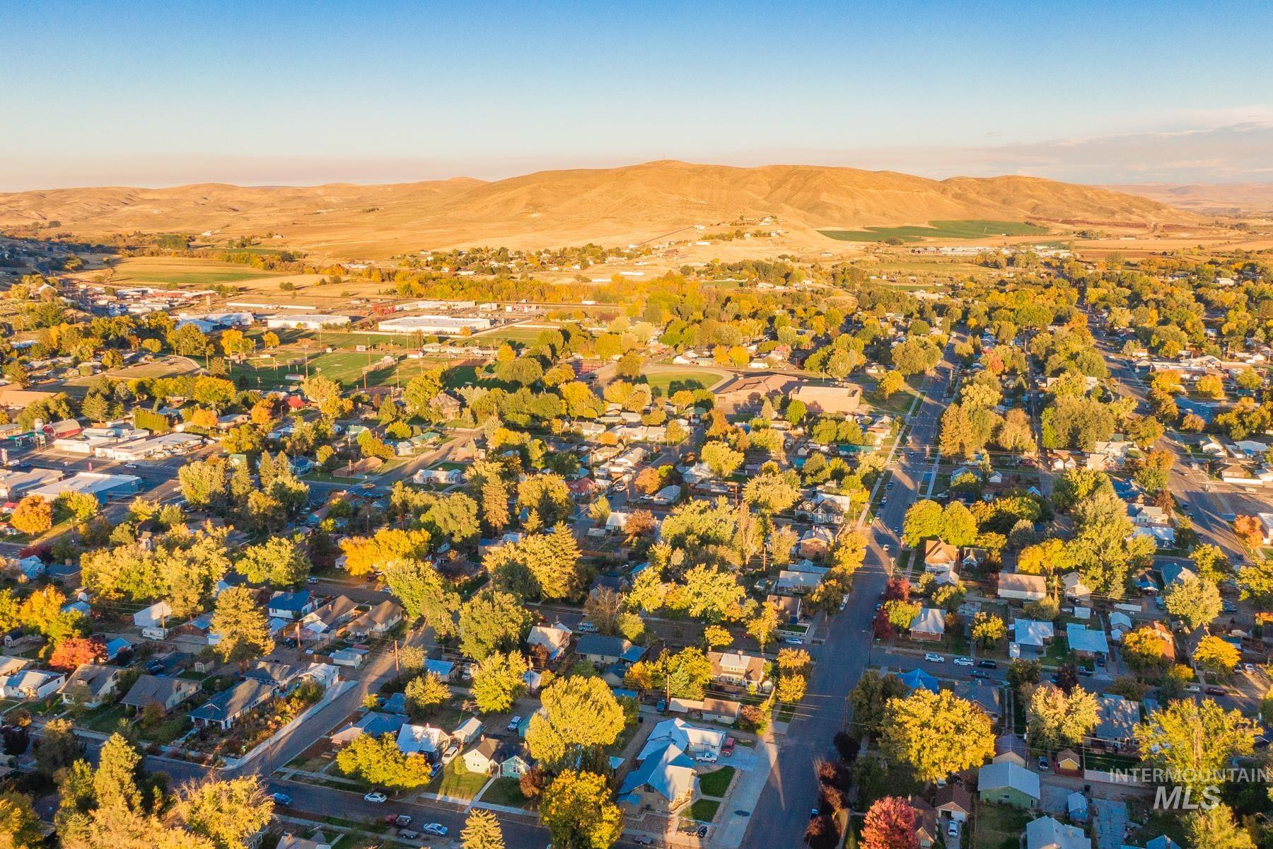 Aerial perspective of suburban area featuring a mountainous background