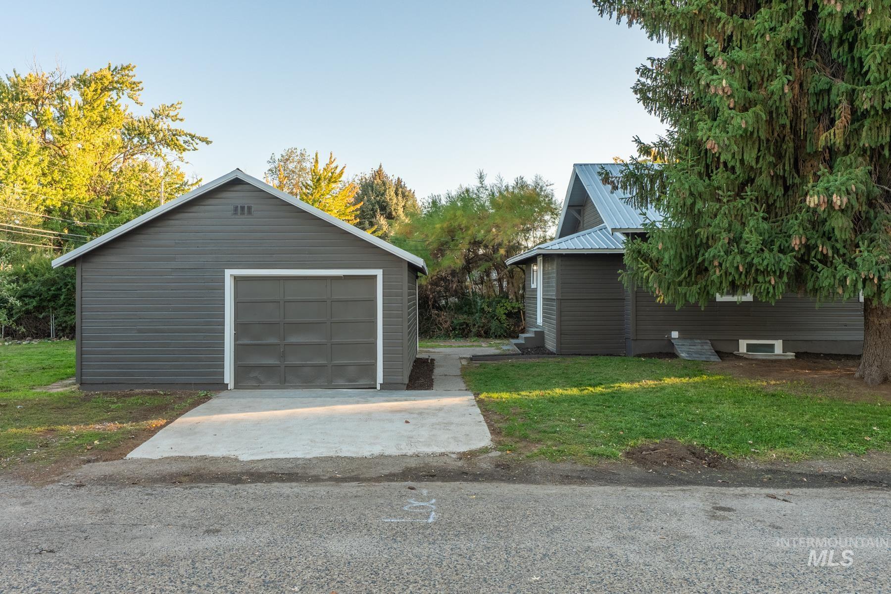 Detached garage featuring driveway