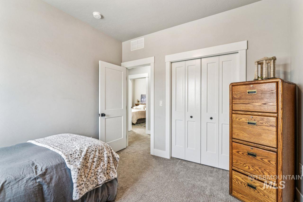 Bedroom with carpet and a closet
