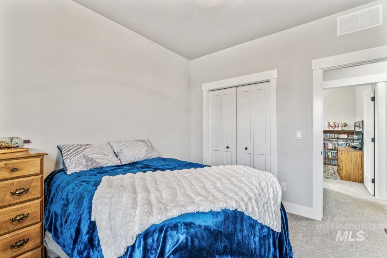 Bedroom featuring carpet floors and a closet