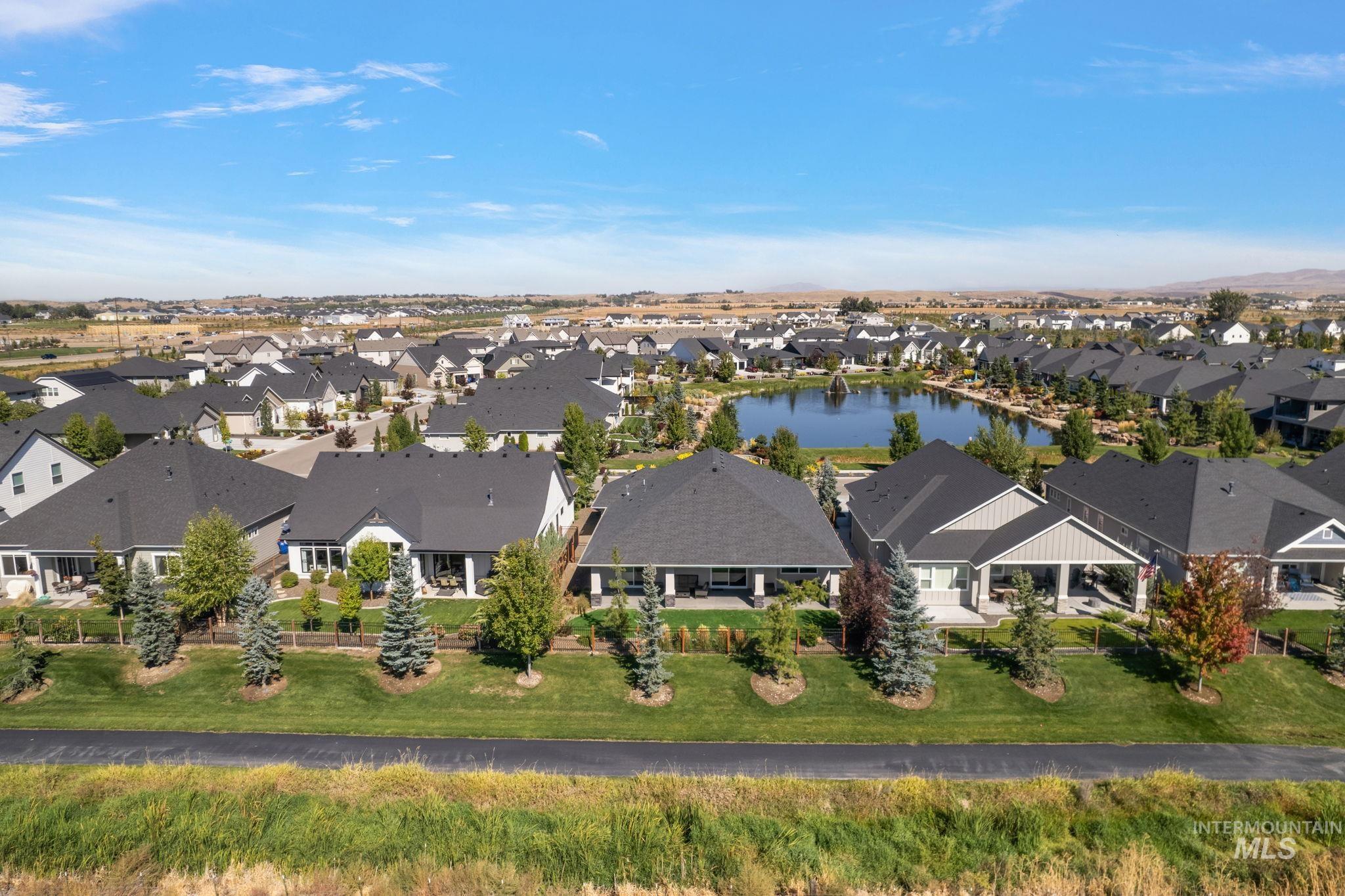 Aerial perspective of suburban area with a large body of water