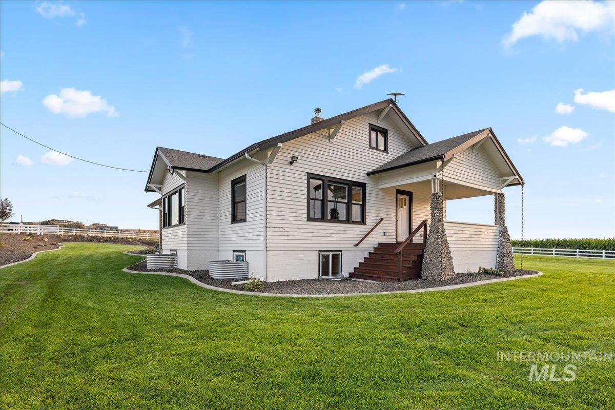Rear view of house with covered porch