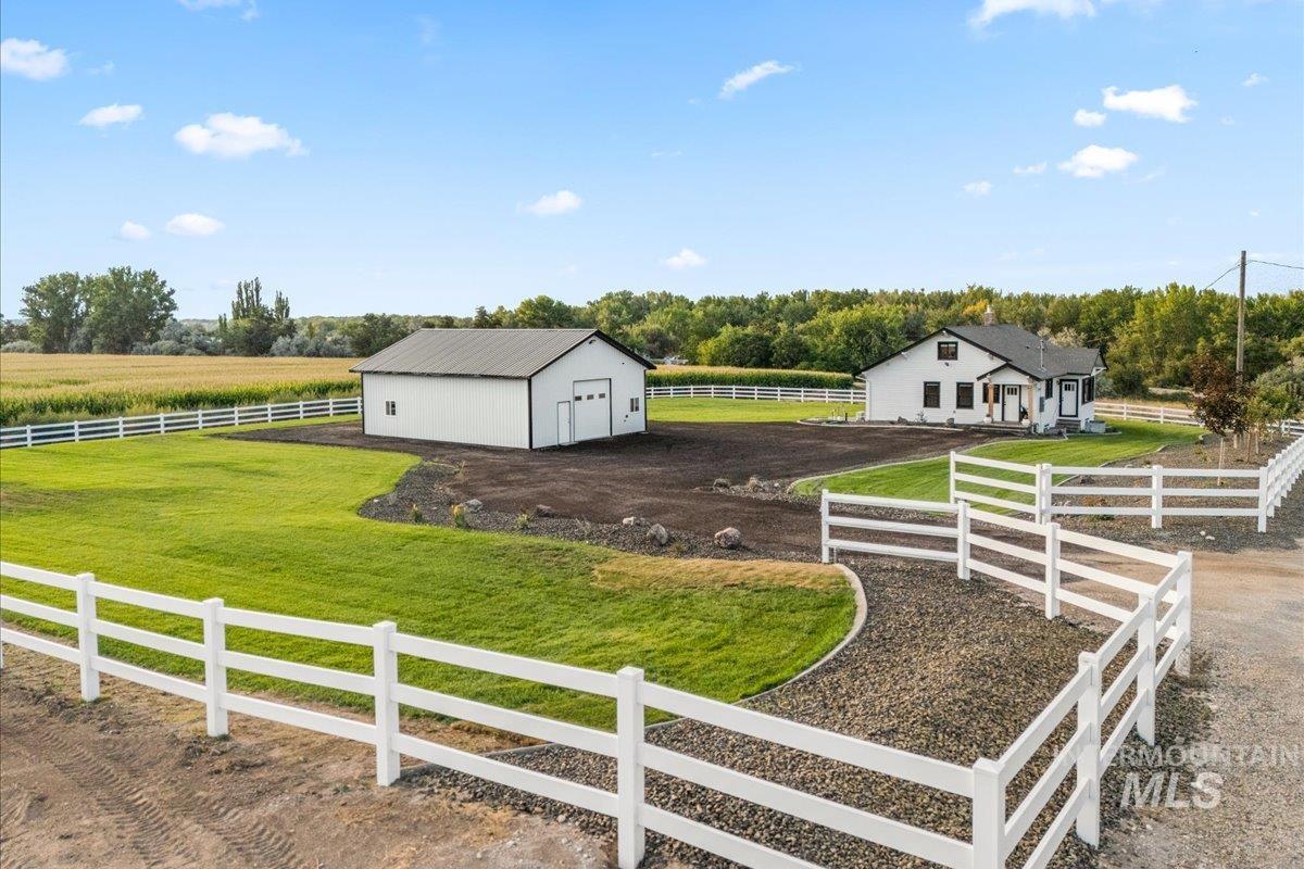 View of yard with a view of rural / pastoral area and an outbuilding