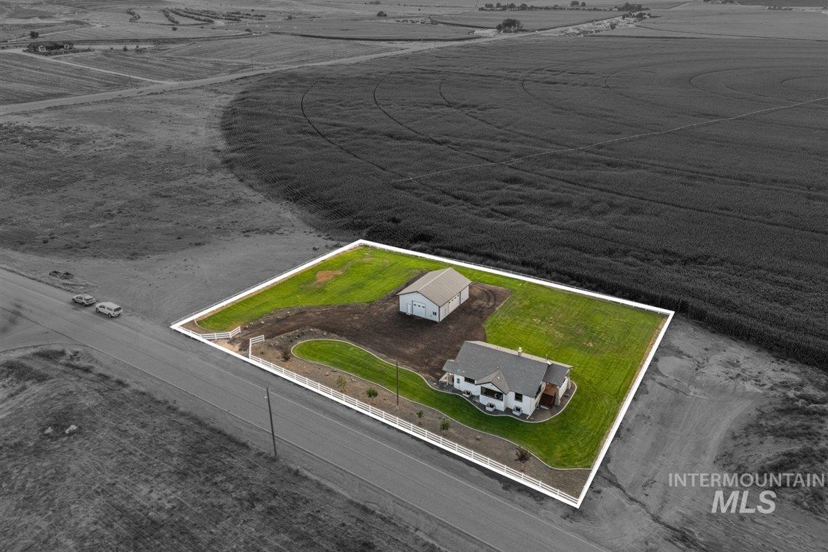 Aerial view of sparsely populated area with property boundaries highlighted