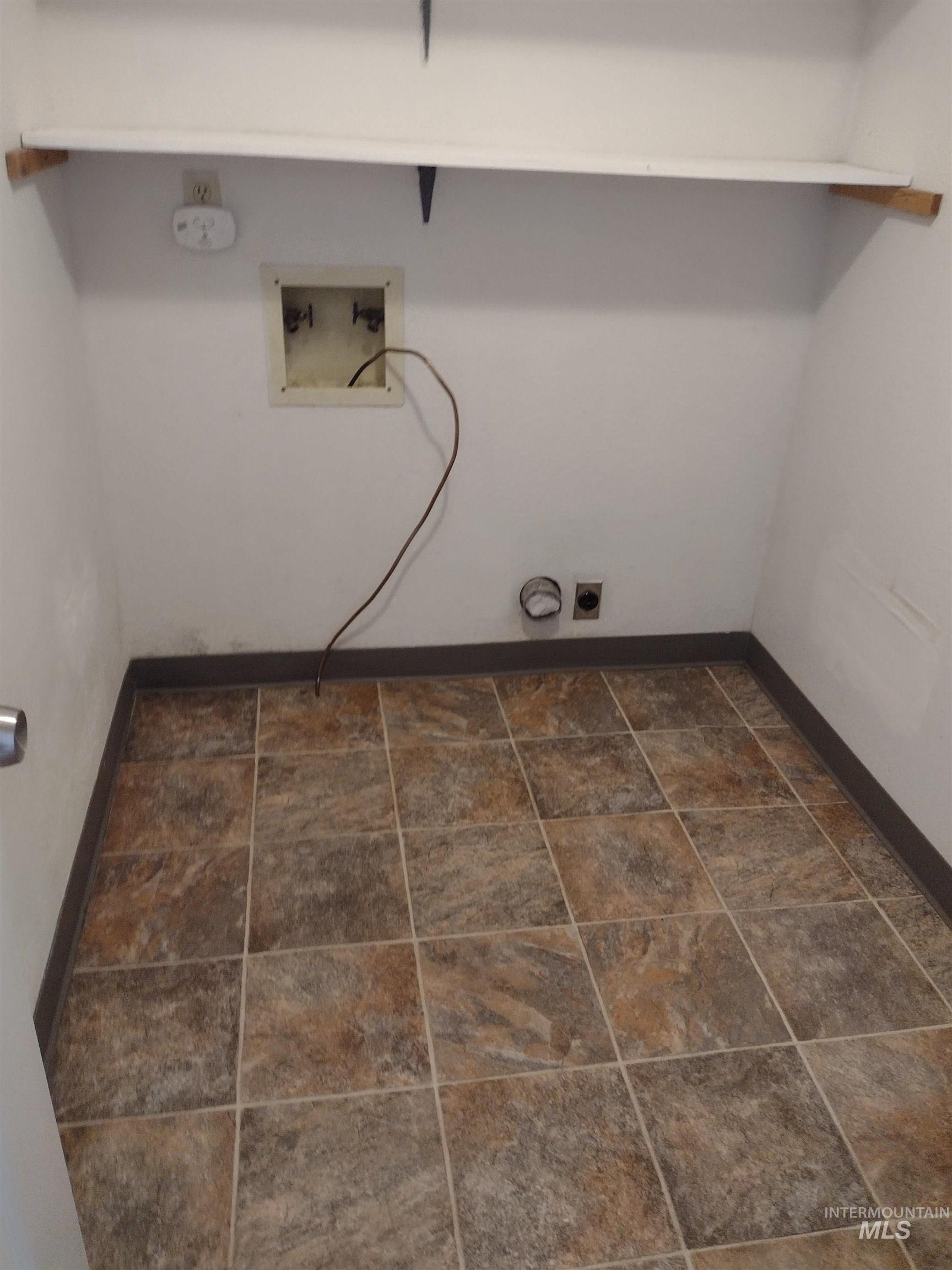 Washroom featuring washer hookup and hookup for an electric dryer