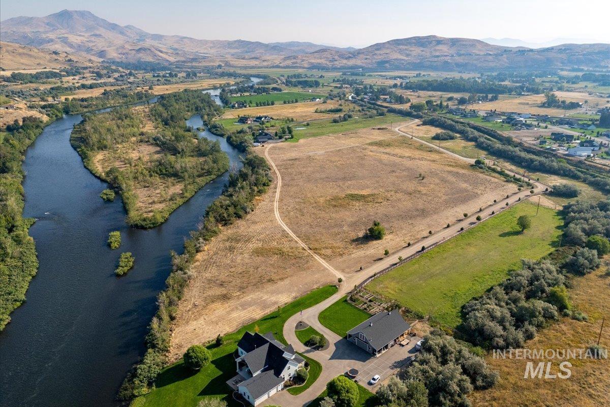 View of property location featuring a water and mountain view