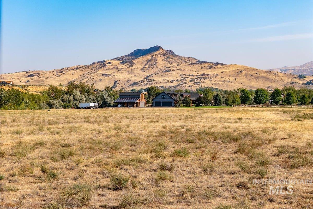 View of mountain background featuring rural landscape