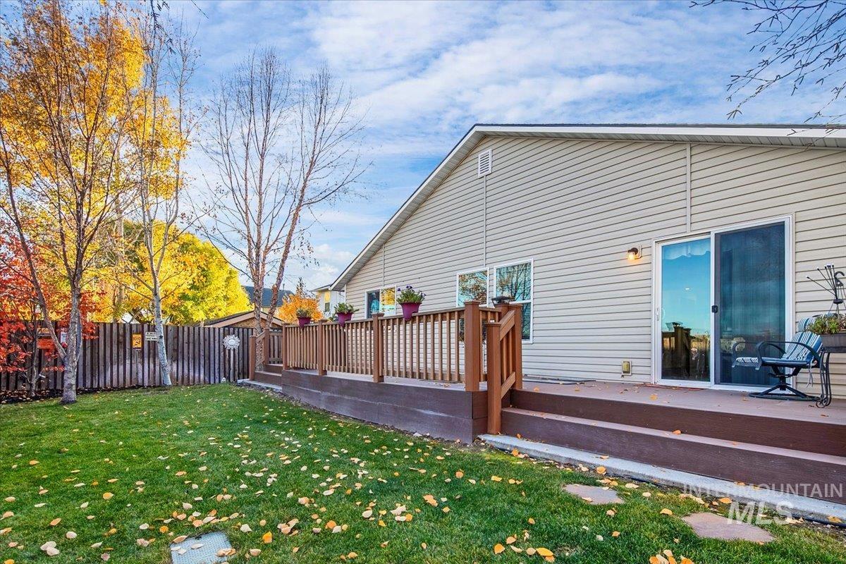 Rear view of house with a wooden deck