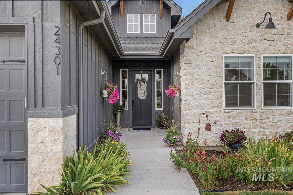 Property entrance with stone siding