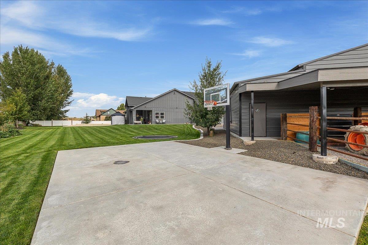 View of patio with basketball hoop