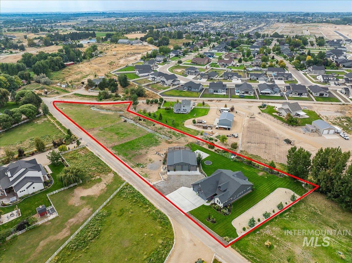 Aerial view of residential area with property boundaries highlighted