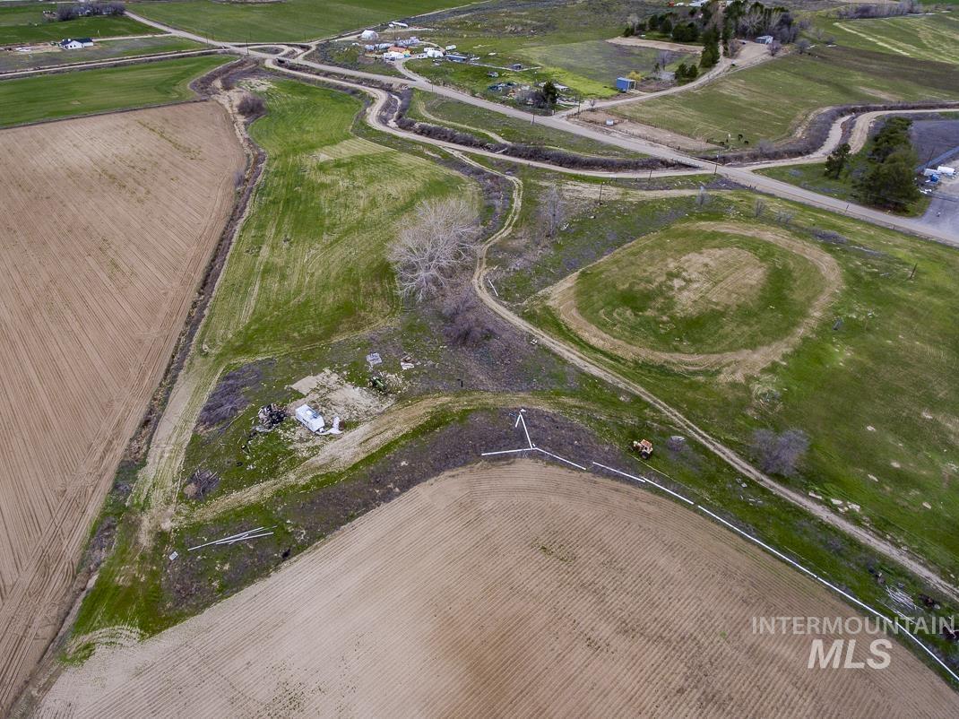 Aerial view of property's location with rural landscape and extensive farmland