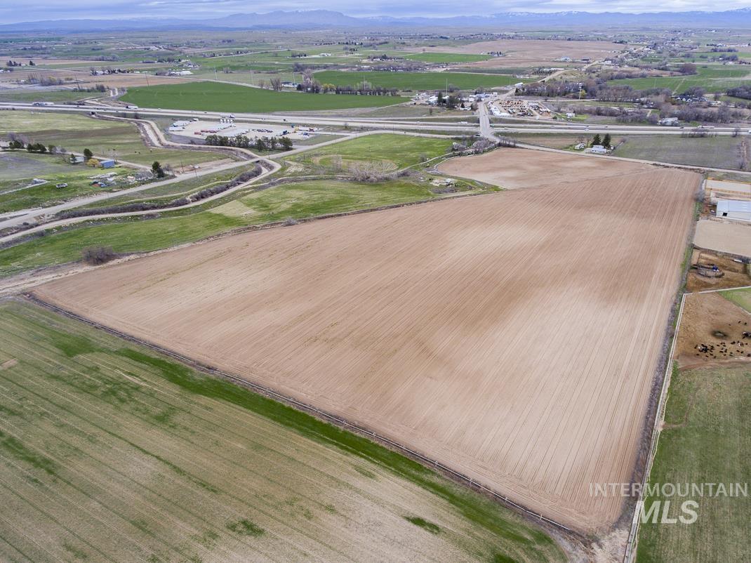 Aerial view of sparsely populated area with a mountain backdrop