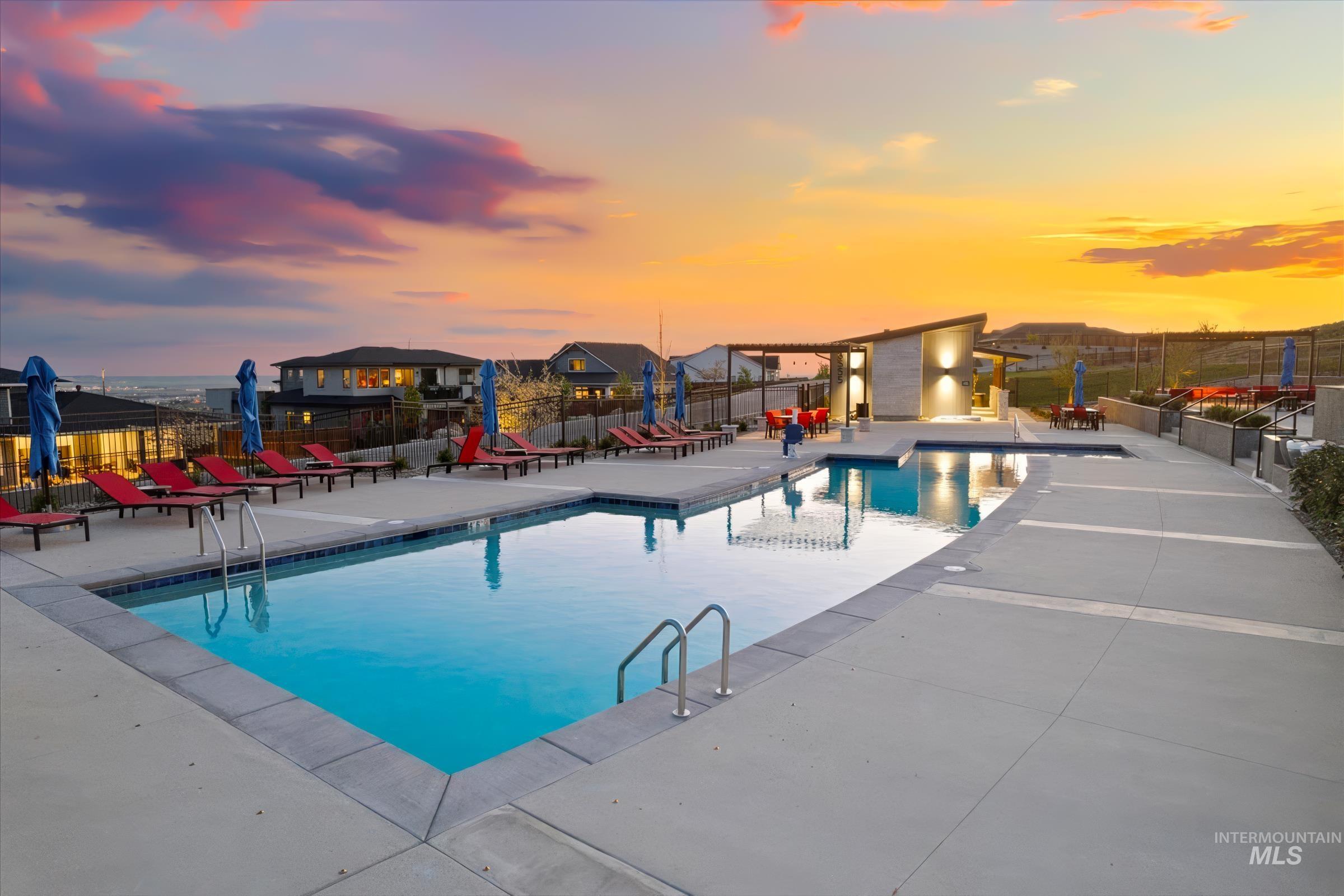 Community pool featuring a patio