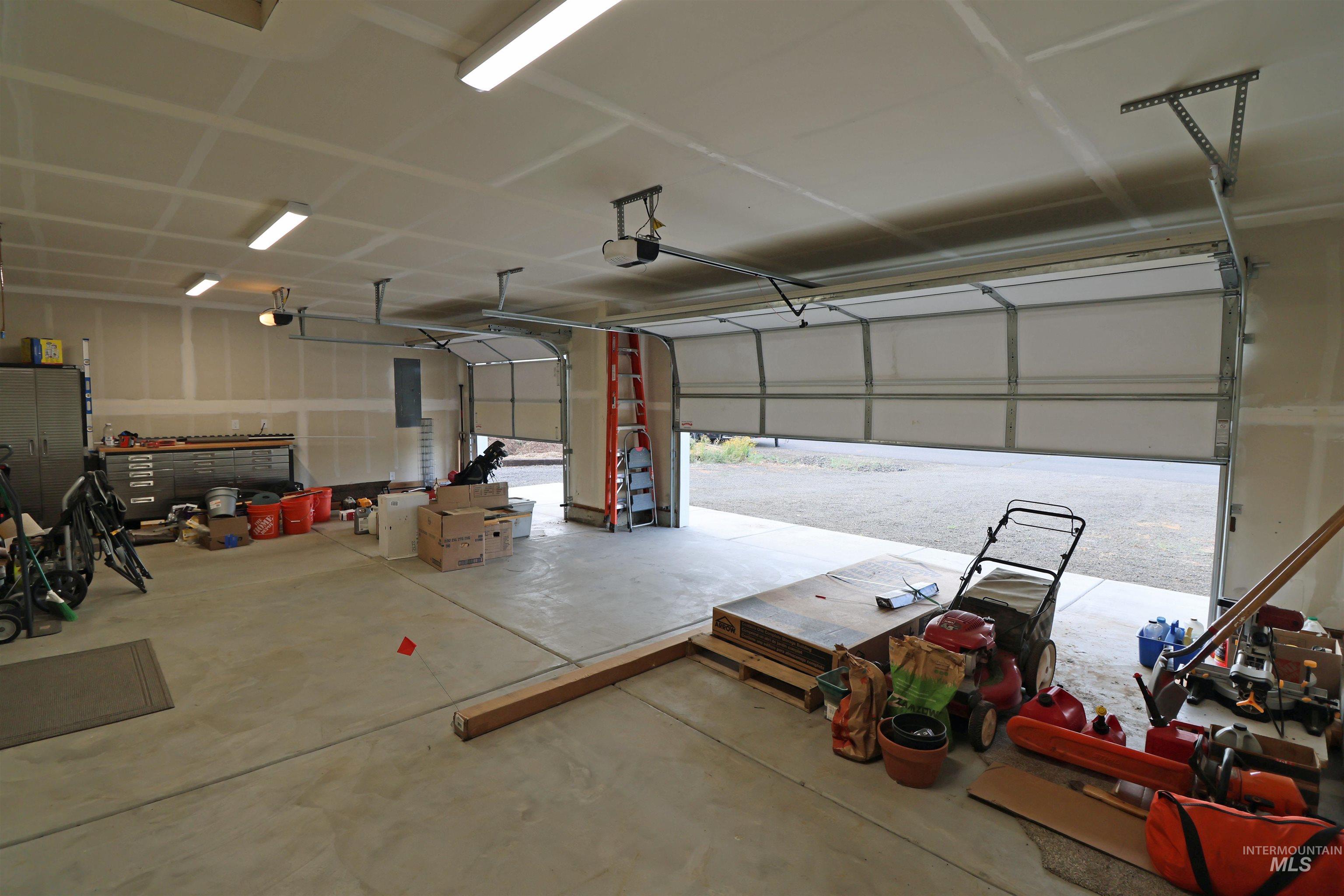 Garage featuring a garage door opener