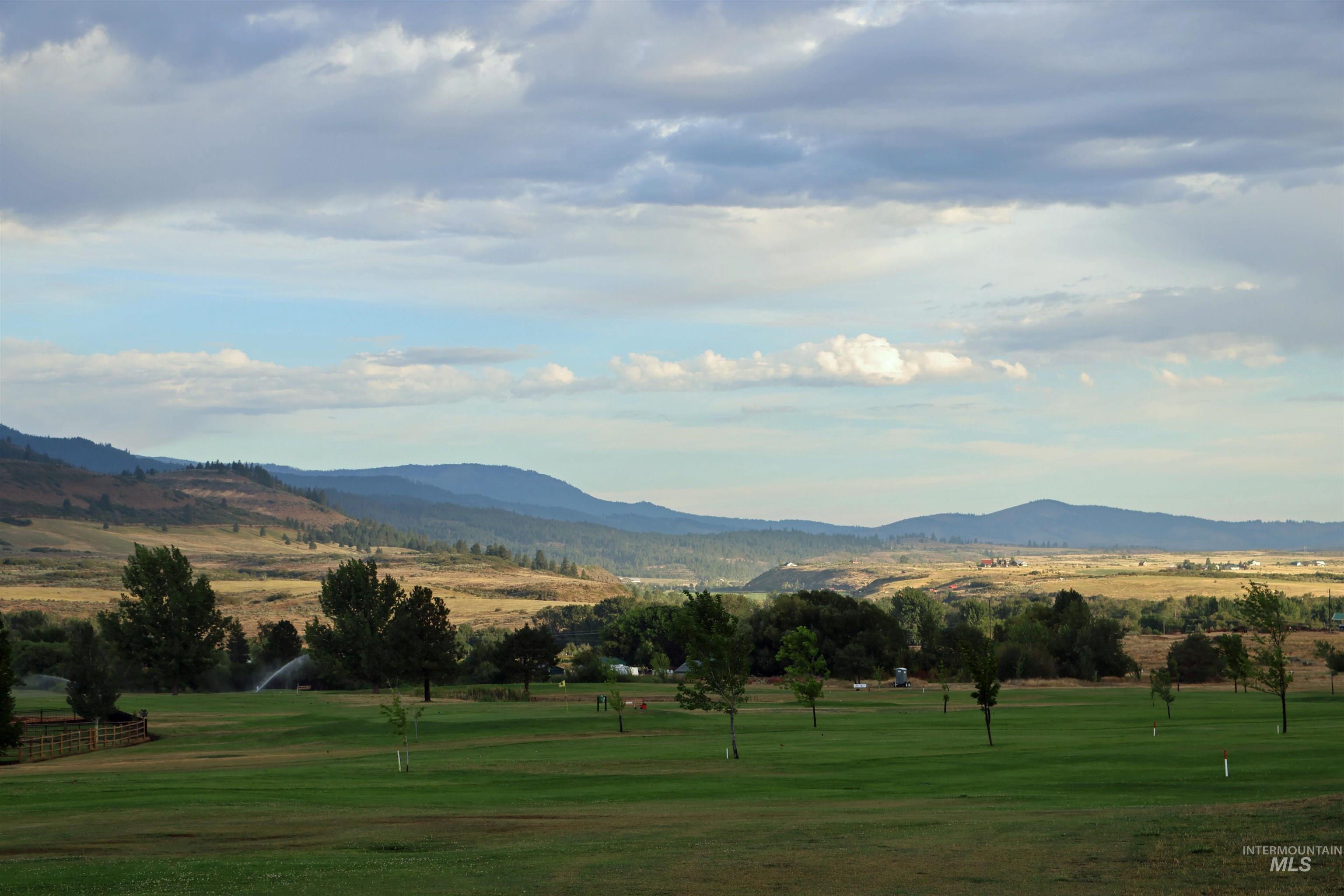Mountain view featuring a golf course