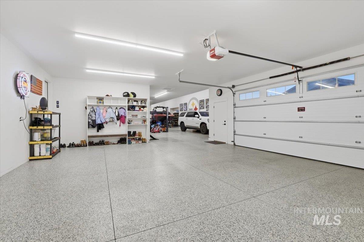 Garage featuring a garage door opener