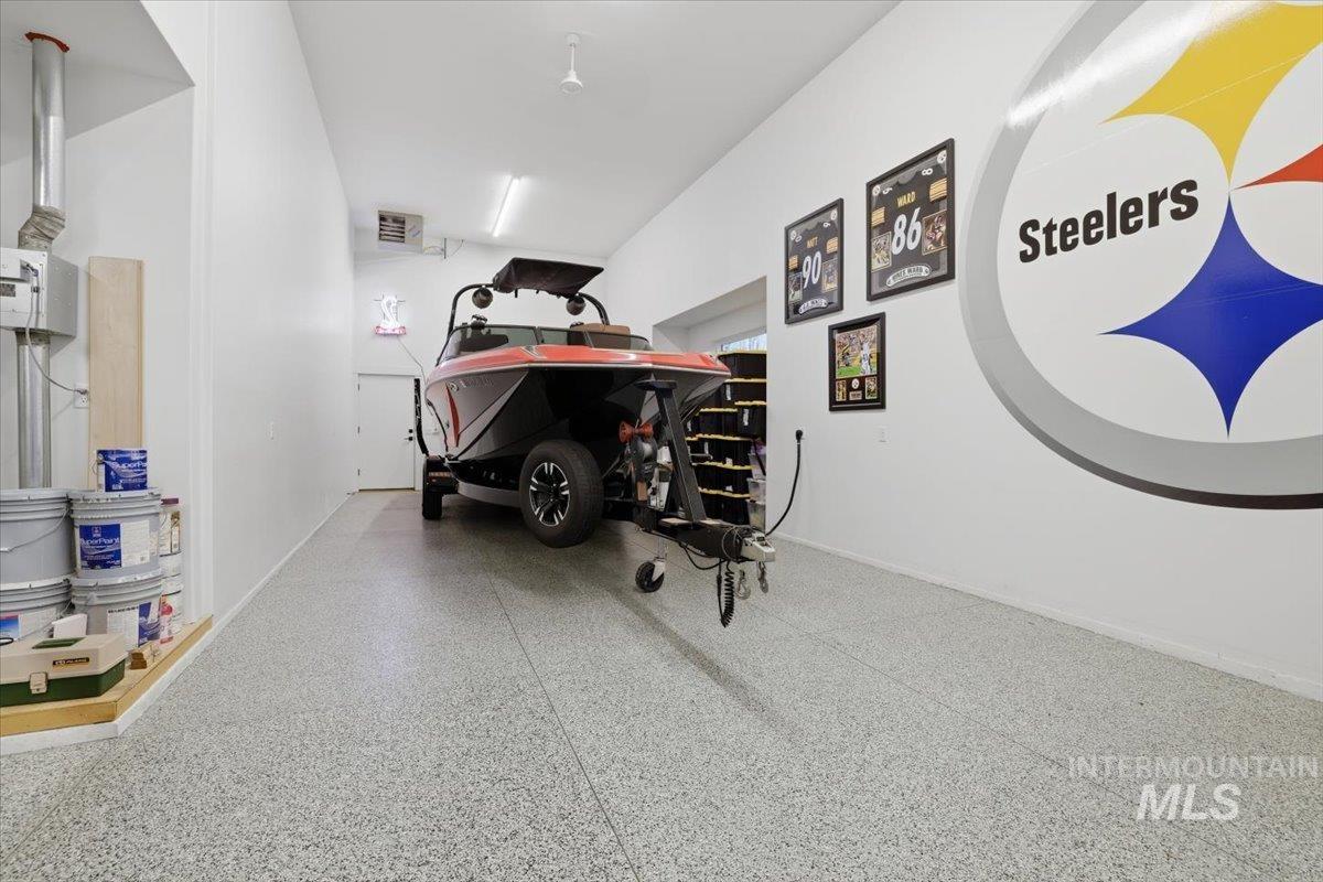 Garage featuring baseboards