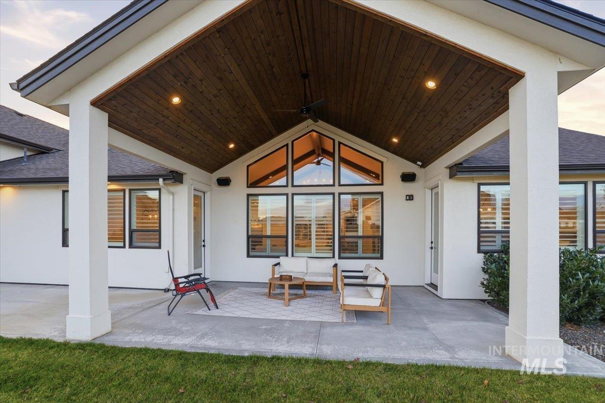 View of patio with an outdoor hangout area