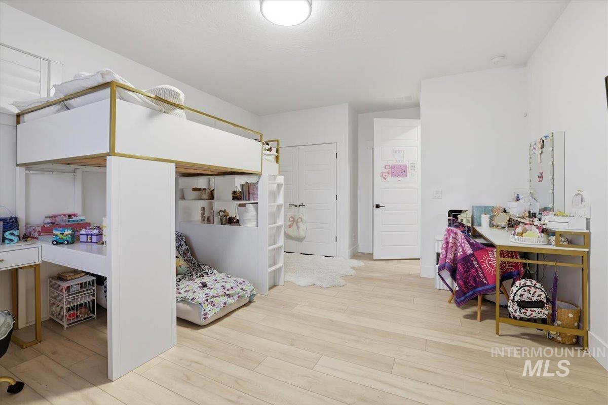 Bedroom with light wood finished floors