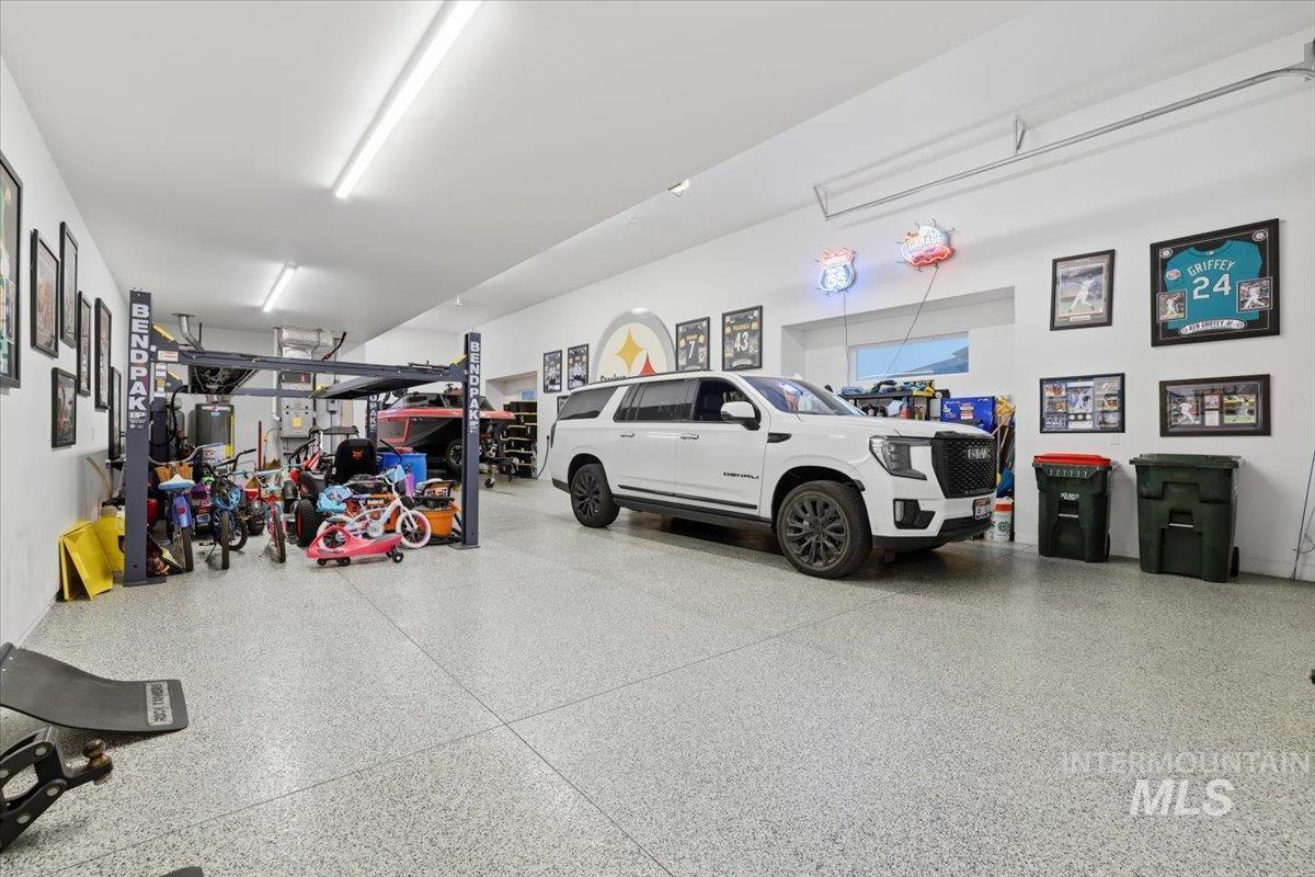 Garage featuring water heater