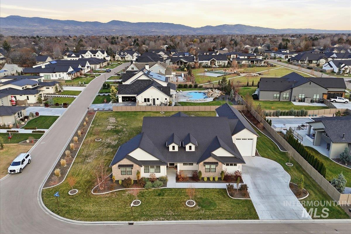 Aerial view at dusk of a residential view and a mountain view