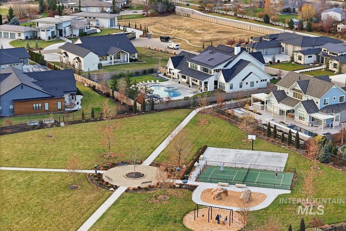 Aerial perspective of suburban area featuring a pool area