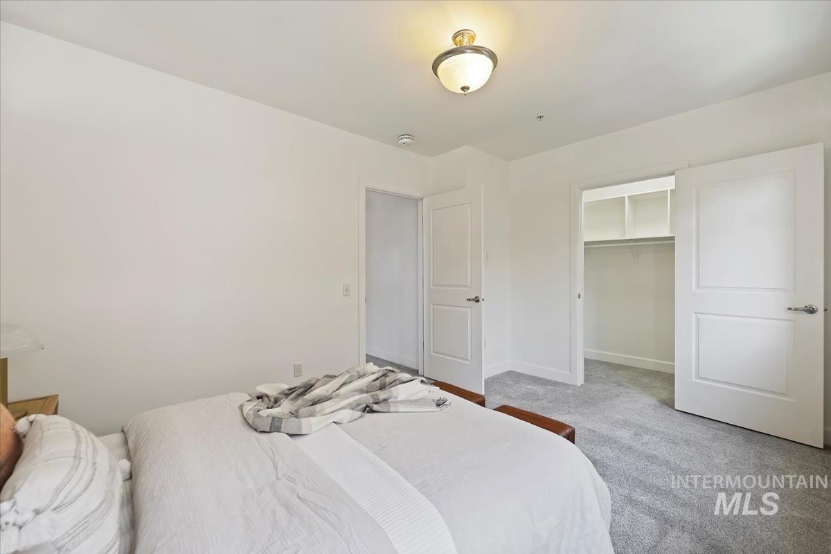 Bedroom with carpet flooring and baseboards