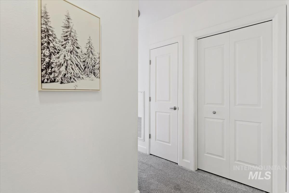 Hallway with carpet floors