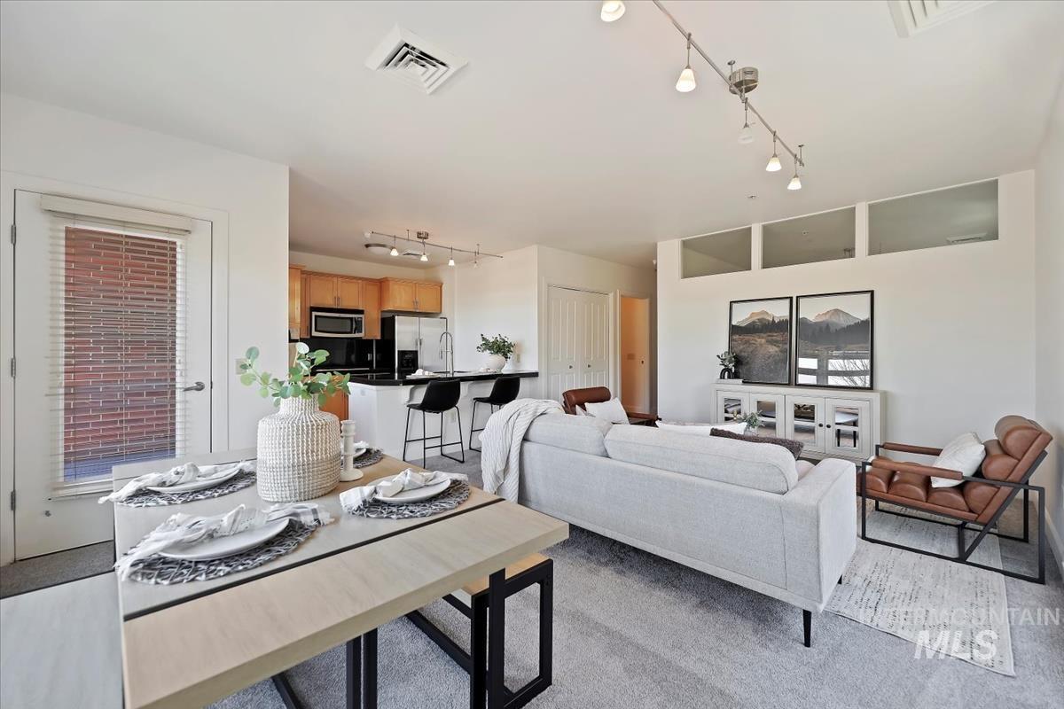 Living room featuring rail lighting