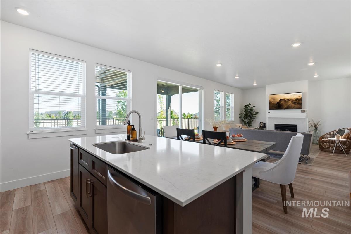 Kitchen island with a stainless steel sink and a light-toned countertop