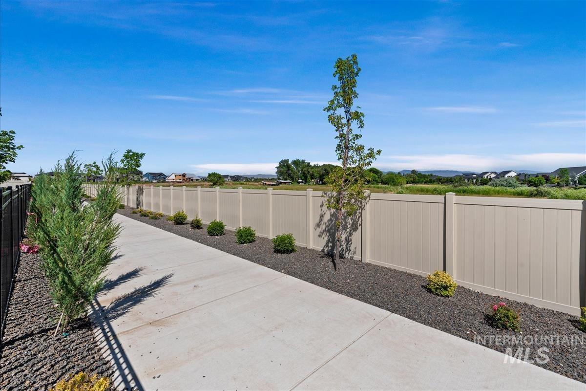 Manicured landscaping framing a concrete walkway