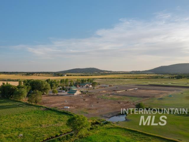 View of mountain background featuring rural landscape and farmland
